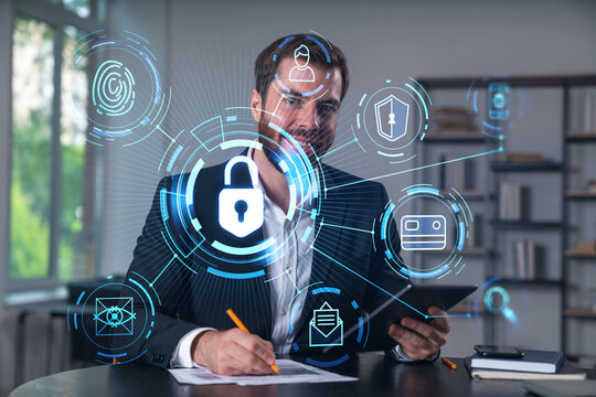 Considered businessman in formal wear signing contract holding tablet device at office room with papers. Concept of successful business deal, agreement, partnership, documents. Lock icons.