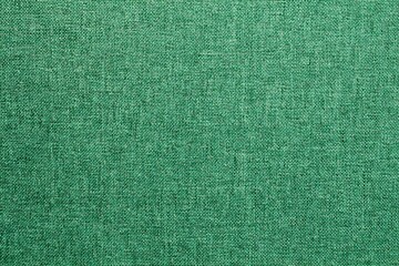 Abstract design background of emerald green coarse-grained intersection texture of rough fabric with an interlacing. Linen sack textile canvas burlap cloth. Close-up, mock up, top view