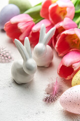 A bouquet of tulips, Easter bunnies and eggs.