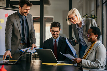 Business diversity - A multi ethnicity suited up dressed team in the discussion.