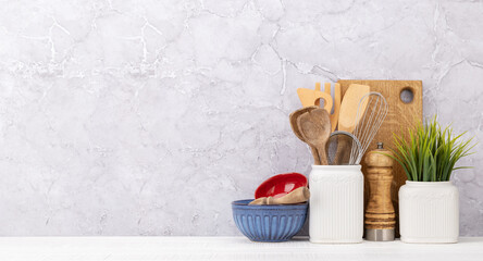 Kitchen utensils on wooden table