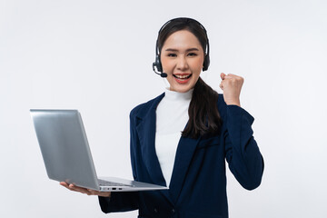 Happy young Asian operator woman agent with headsets working in a call center using laptop computer...