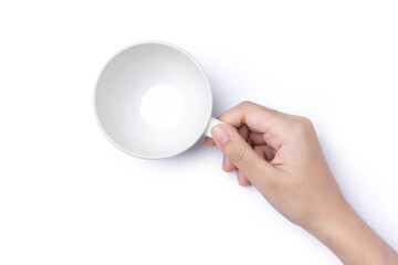 Female hand holding empty coffee cup isolated on white background with clipping path, top view,...