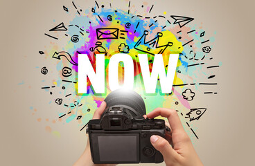 Close-up of a hand holding digital camera with abstract drawing