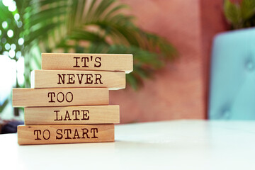Wooden blocks with words 'It's never too late to start'.