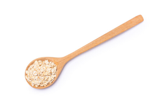 Oat flakes in wooden spoon isolated on white background - Powered by Adobe