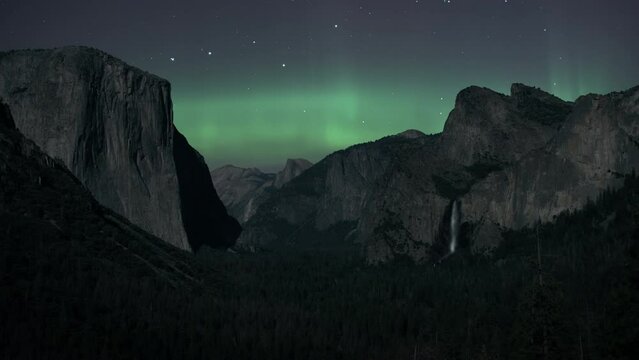Northern Lights (Aurora Borealis) are shining over Yosemite National Park. Time Lapse. 