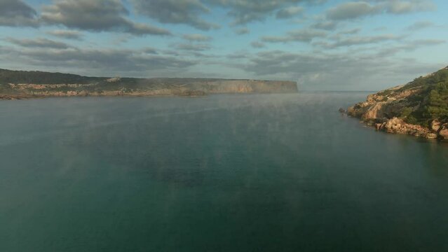 Flying through the clouds over Sin Titulo in Menorca, Spain