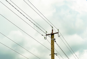 Power electric pole with line wire on colored background close up