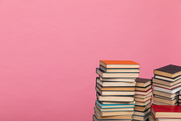 many books on a pink background in the library in the office of science knowledge reading