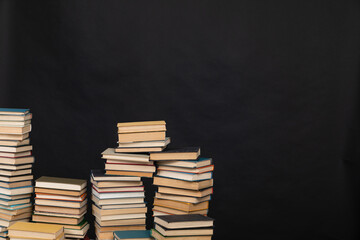 science a lot of books on a black background reading in the library in the knowledge office