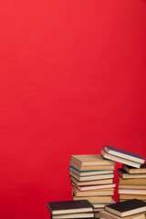 knowledge science many books on a red background reading in the library in the office