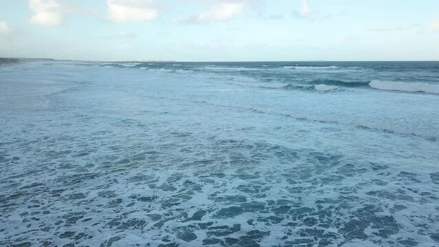 Aerial Portuguese Atlantic waves rolling Silver cliffs shoreline