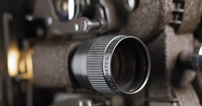 Macro Shot of 8mm Projector Lens showing an old film reel
