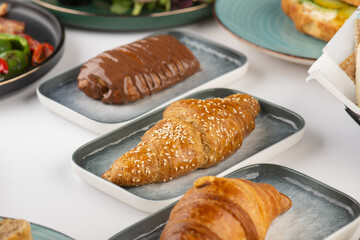 Fresh tasty croissants of Cheese, Thyme and Chocolate on a plate	
