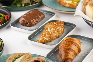 Fresh tasty croissants  of Cheese, Thyme and Chocolate on a plate 