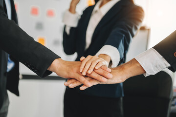 Obraz premium Woman lawyer hand and women client shaking hand collaborate on working agreements with contract documents at the modern office..