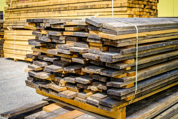 heap of wooden planks at a construction site
