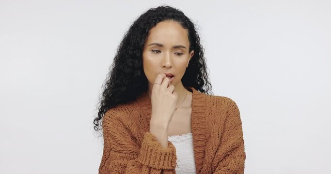 Stress. nail biting and back woman with anxiety, confused and lady against a grey studio background. Female, chew nails and lady with mental health issue, suffering and worrying with problem and fear
