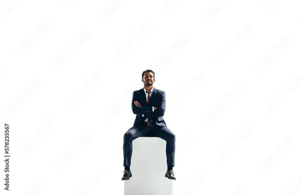 Wall mural confident young businessman sitting on top of a block on a transparent background