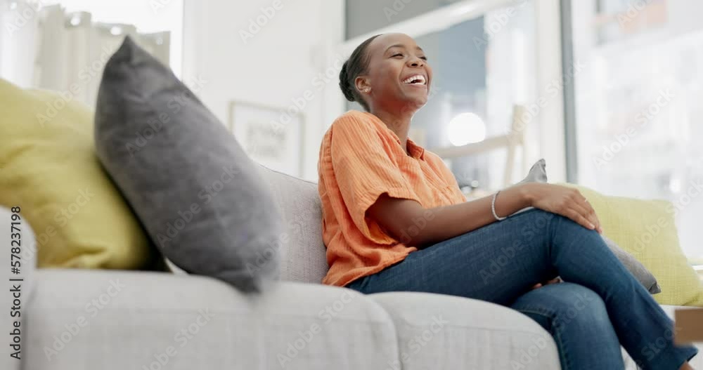 Sticker Funny, black woman on couch and relax with remote, happiness and peace in living room. African American female, lady and watching television on sofa, laughing or smile with break, comfortable or rest