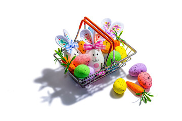 Easter sale concept. Shopping basket with festive symbols - rabbit, eggs, bird, traditional decor