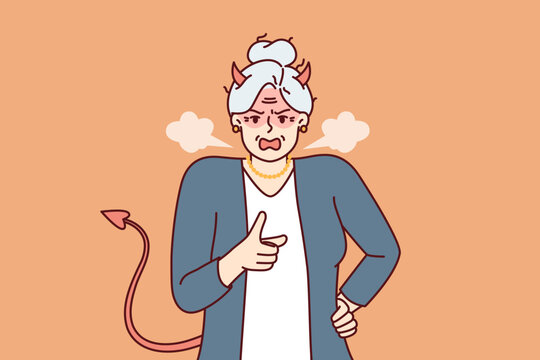 Elderly woman with horns and devil tail screams and points with finger, scolding and threatening opponent. Gray-haired woman pensioner in image of devil feels hatred for concept of senile aggression