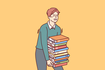 Exhausted man carries large stack of books suffering from overload while preparing for exams. Guy student who wants to go to college or university takes books and literature from library