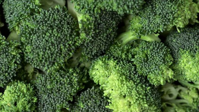 Broccoli slices rotating top view. Fresh broccoli cabbage rotating closeup.