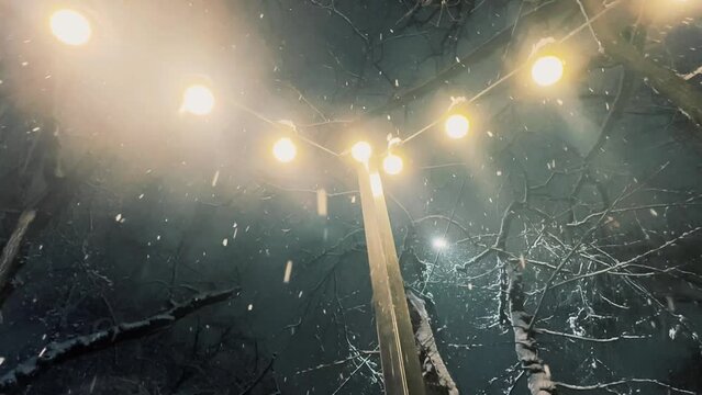 Snowfall Lighting by Street Garland Lamp Lantern. Winter Season Atmospheric Video