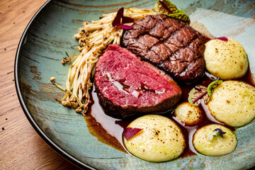 steak with vegetable puree and sauce