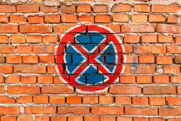 No stopping and no parking sign on old worn wall