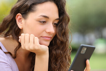 Woman using smart phone outside