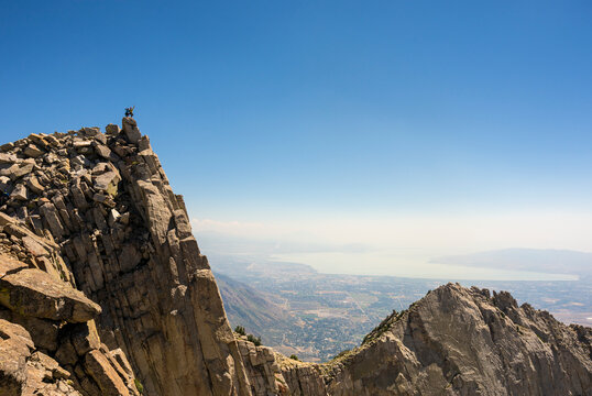 A father and son on the summit of Lone Peak, Utah