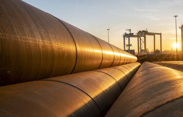 Fototapeta Metal pipeline in industrial area photographed with depth of field effect obraz