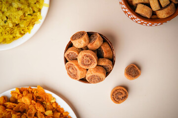 Top Shot Of Bhakarwadi In Wooden Bowl