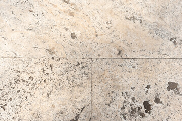 Light gray square paving stabs close-up. Texture of old stone tiles