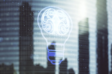 Abstract virtual idea concept with light bulb and human brain illustration on office buildings background. Neural networks and machine learning concept. Multiexposure