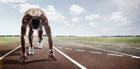 Sport. Runner. Athlete on  the start line. - 578257592
