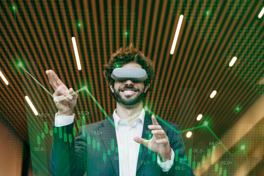 Happy businessman wearing virtual reality simulator gesturing in office