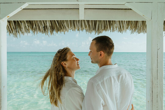 Romantic couple enjoying vacation by sea