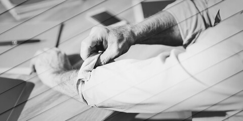 Businessman rolling up his sleeves, geometric pattern
