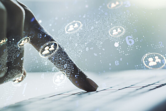 Double exposure of social network icons concept with world map and hands typing on laptop on background. Marketing and promotion concept