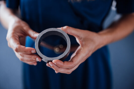 Hands of businesswoman holding circular equipment in office