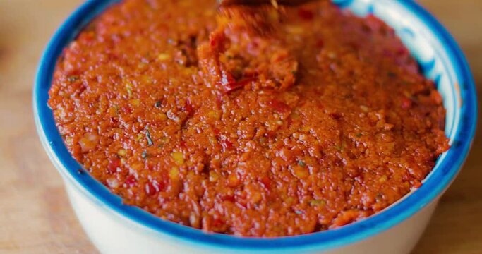 Traditional Middle eastern muhammara dish or Traditional Turkish food acuka. Food placed on the table is spread on toasted bread