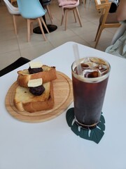 coffee on the table
cafe
straw
glass cup
ice coffee

toast
red bean paste butter