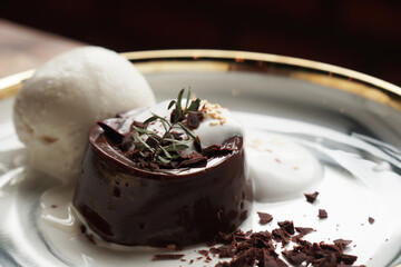 Closeup dessert of Chocolate pudding with ice cream in white plate - sweet and delicious - image from Nan Thailand 