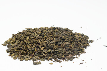 Heap of dry green tea isolated on white background