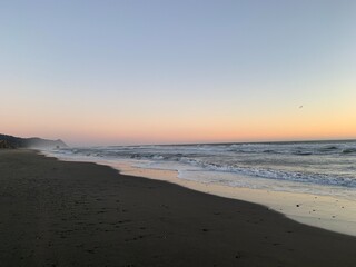 Fototapeta na wymiar misty sunset at the beach