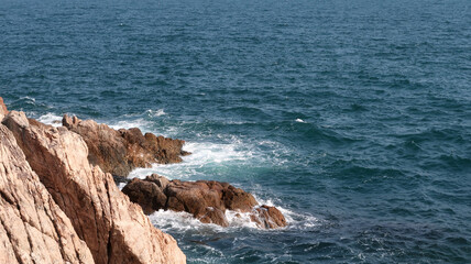 waves crashing on rocks